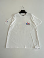 White T-shirt with small chest patch and small sleeve emblem