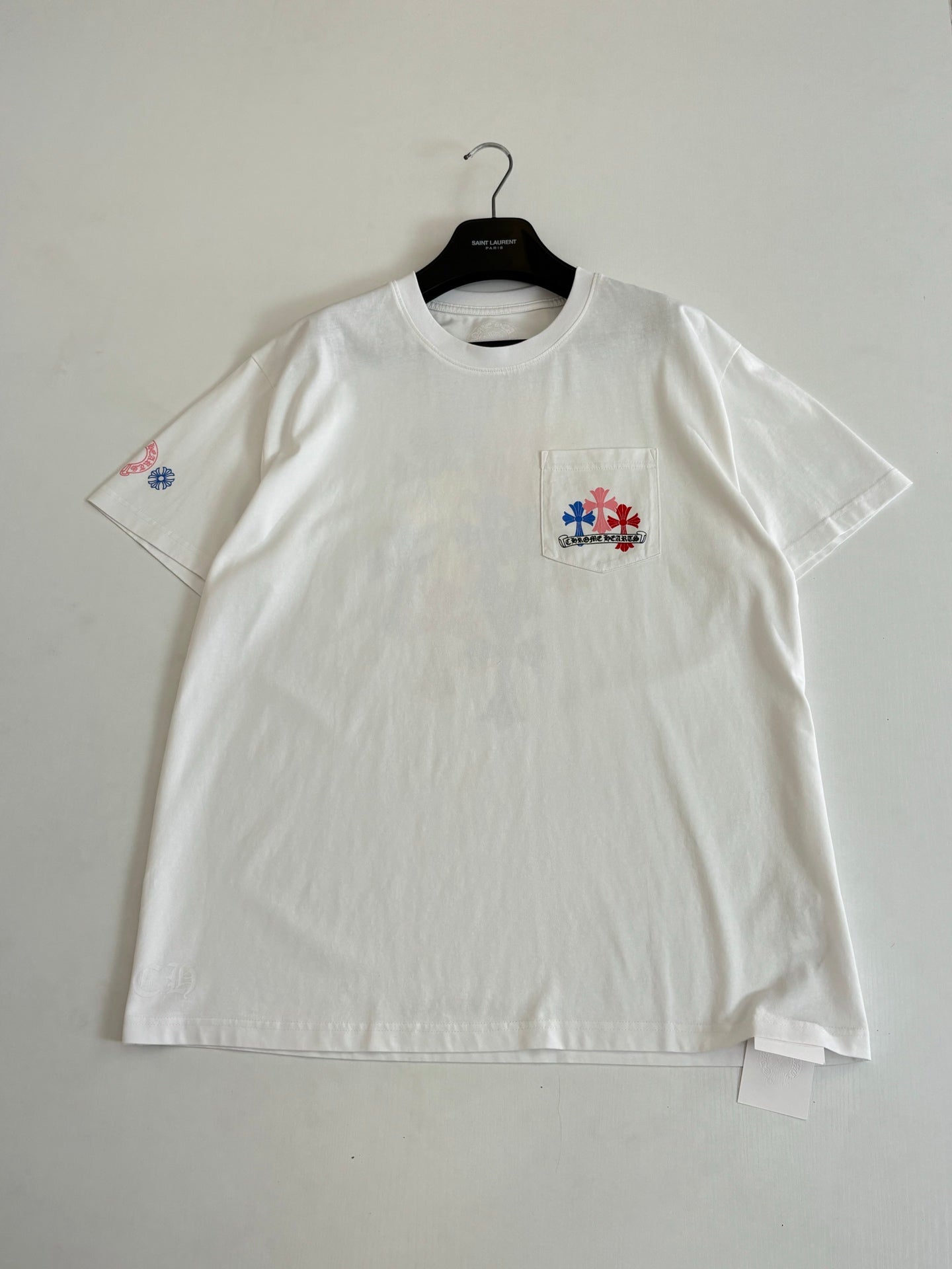 White T-shirt with small chest patch and small sleeve emblem