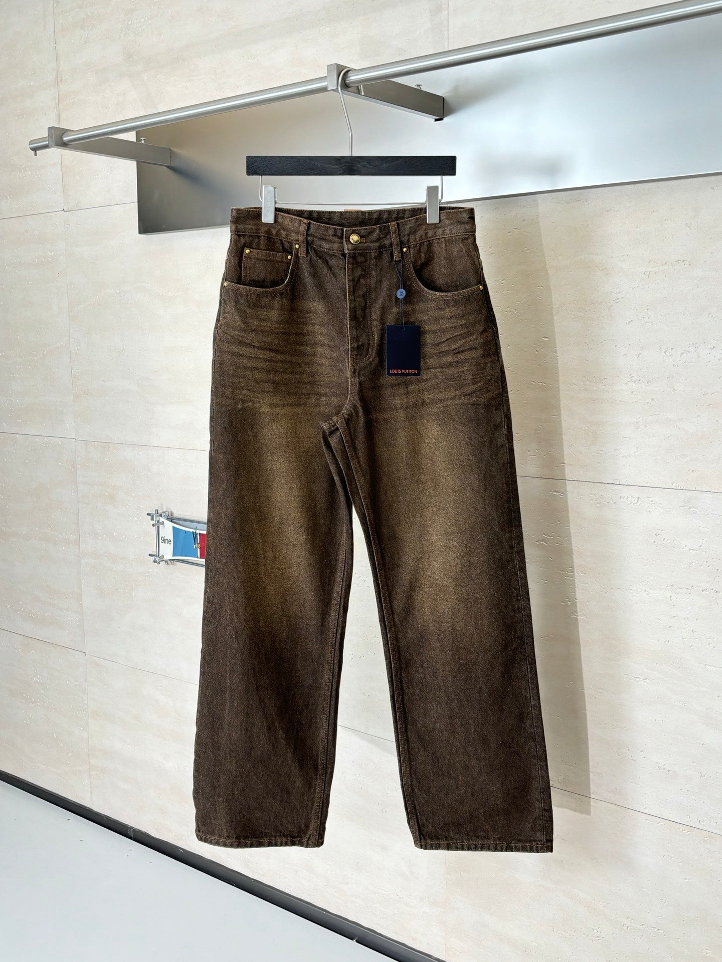 Louis Vuitton brown denim pants on hanger, button fly and front pockets
