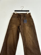Louis Vuitton brown denim pants with belt loops, front creases and tag