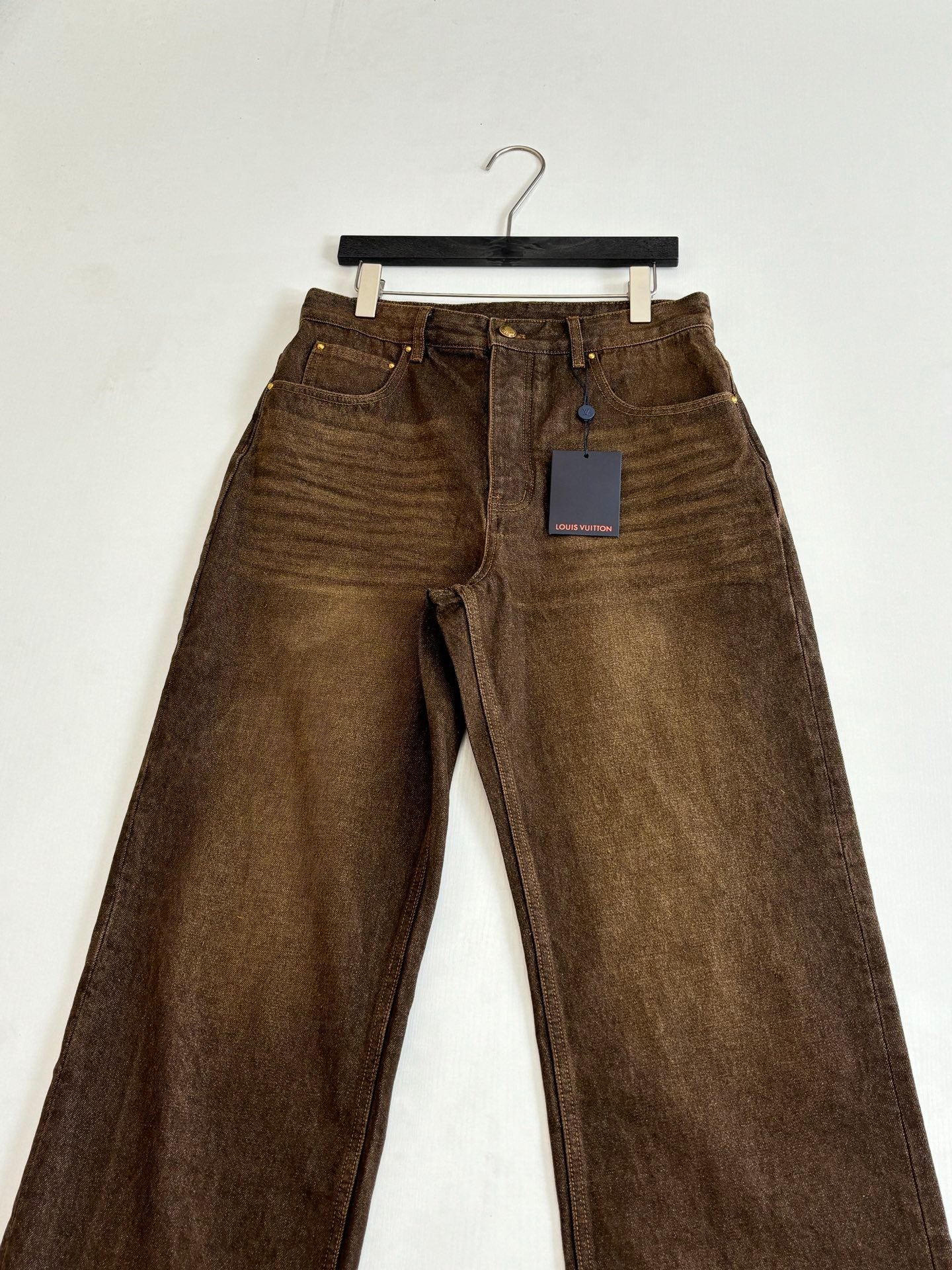 Louis Vuitton brown denim pants with belt loops, front creases and tag