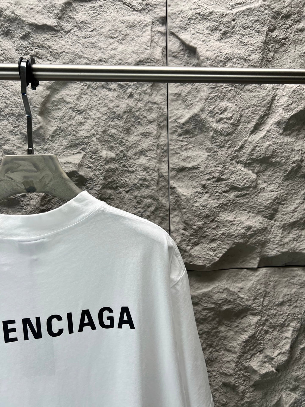 Balenciaga white T-shirt with partial BALENCIAGA lettering at hem