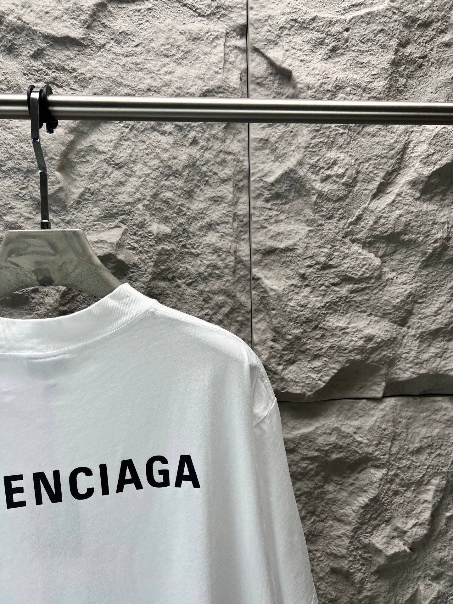 Balenciaga white T-shirt with partial BALENCIAGA lettering at hem