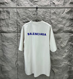 White crew-neck T-shirt with large blue Balenciaga logo on back