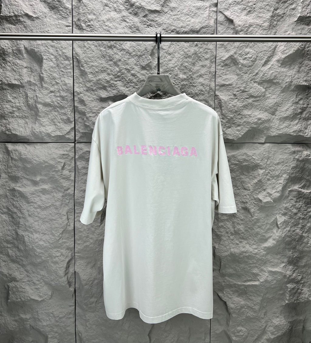 White T-shirt with large pink BALENCIAGA logo on back