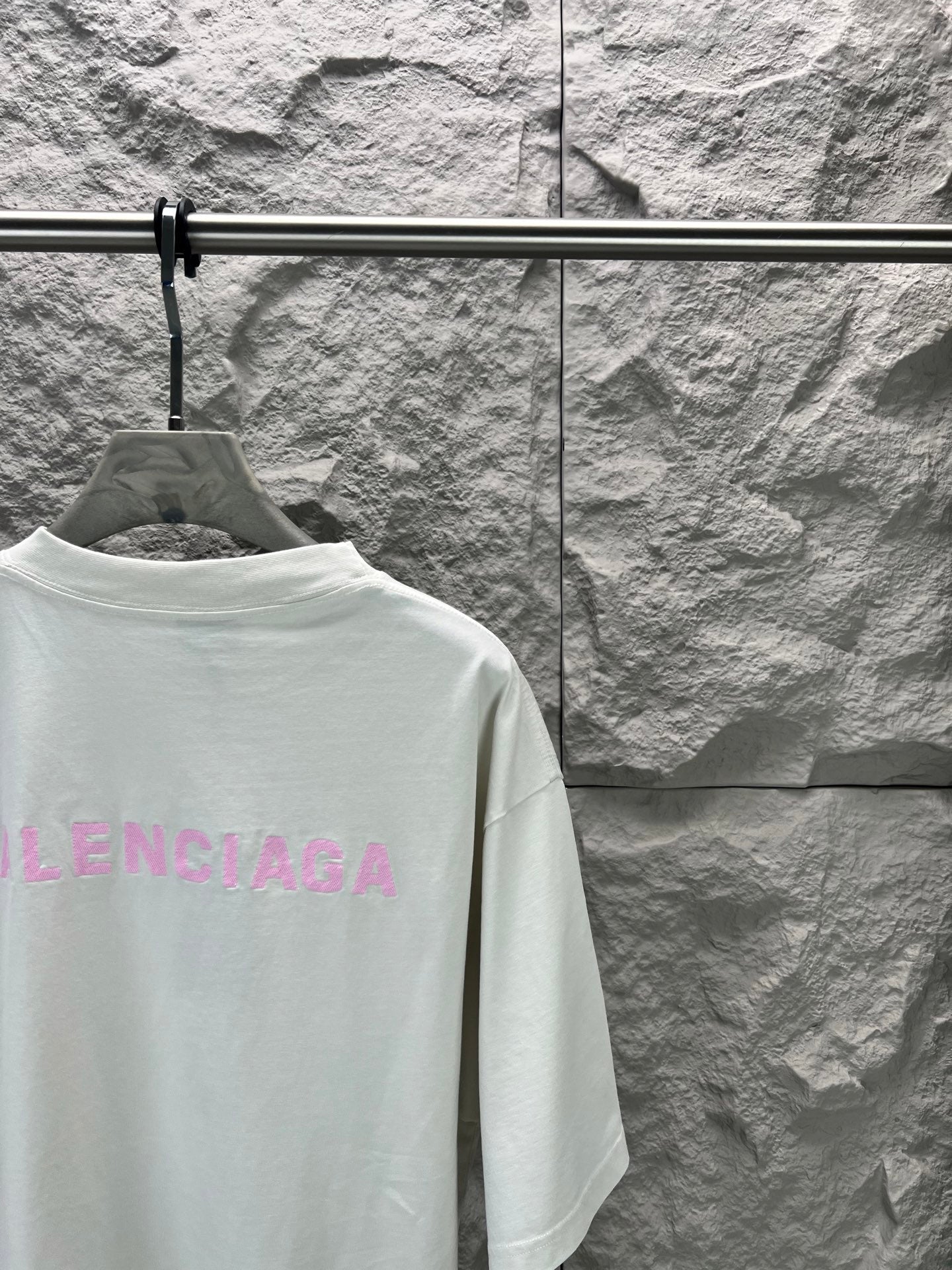 White T-shirt back with partial pink BALENCIAGA logo