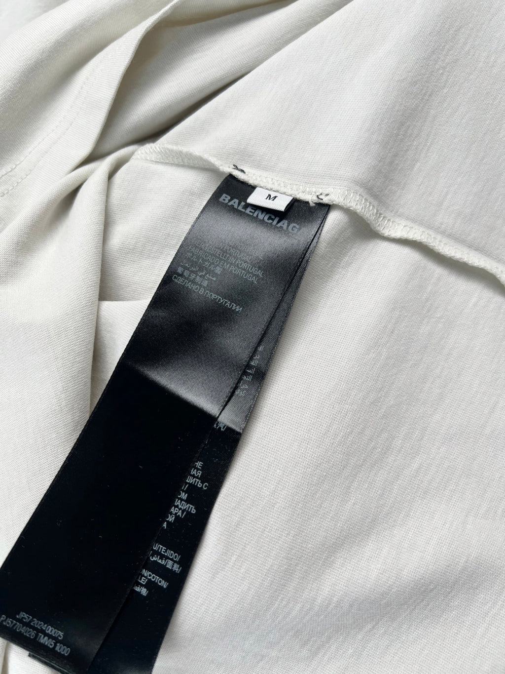 White T-shirt with interior care label and size tag