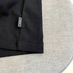 Versace T-shirt size tag, black fabric label on sleeve