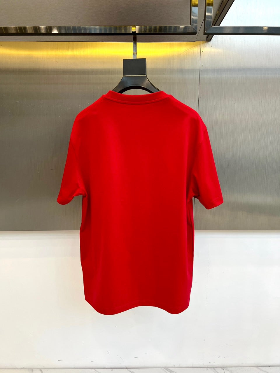 Versace red T-shirt back view on hanger