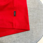 Versace red T-shirt with branded neck label tag near shoulder seam
