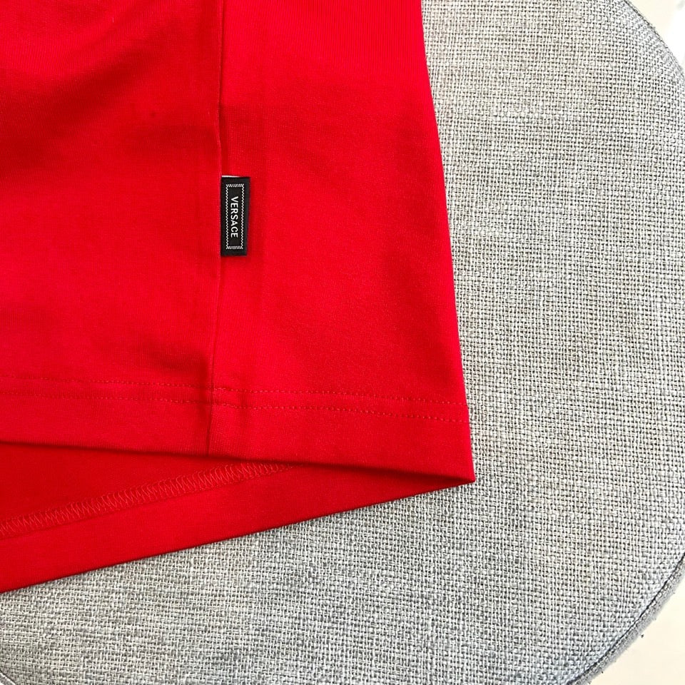 Versace red T-shirt with branded neck label tag near shoulder seam