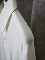 White polo shirt sleeve and side seam close-up