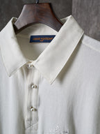 White polo shirt collar with button placket and stitching detail