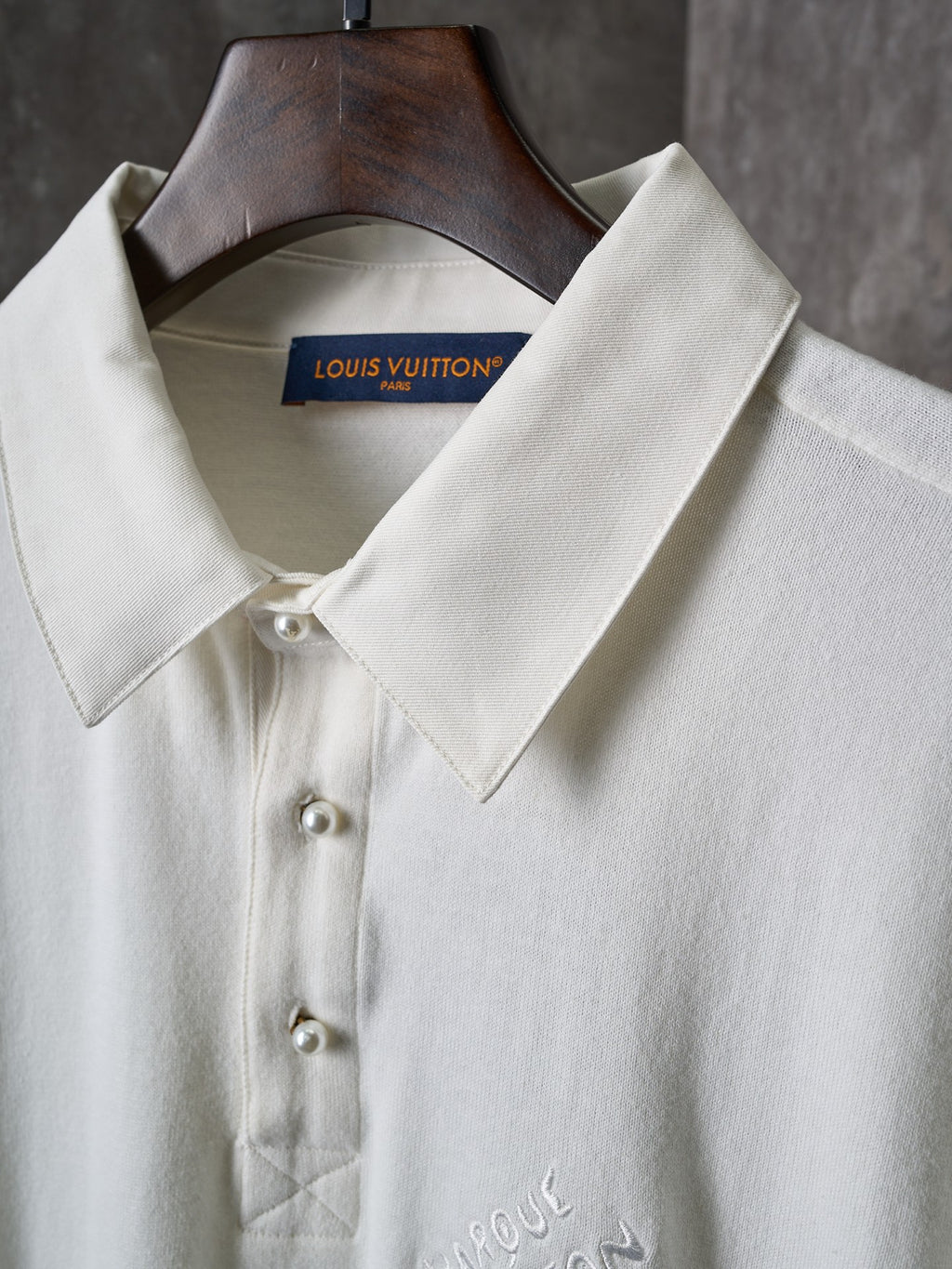 Louis Vuitton white polo collar with button placket and pearl-style buttons