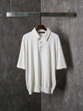 White polo shirt with button placket and short sleeves