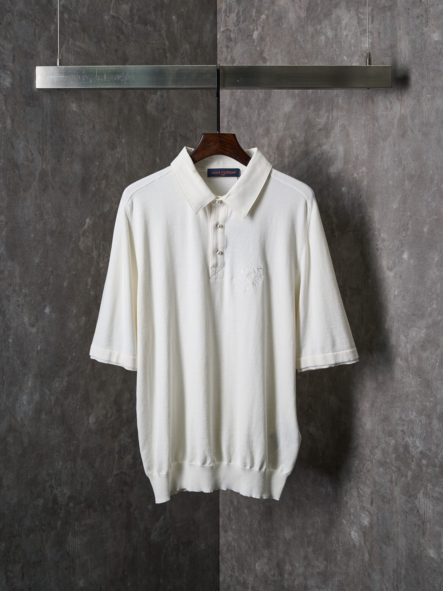 White polo shirt with button placket and short sleeves