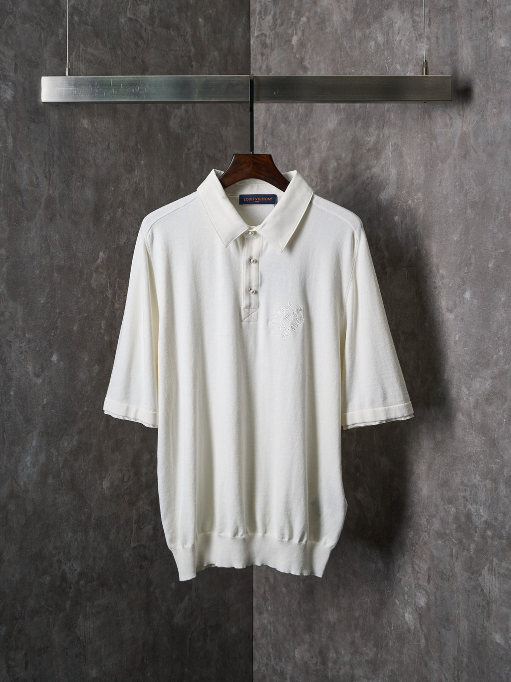 White short-sleeve polo shirt with button placket and ribbed hem