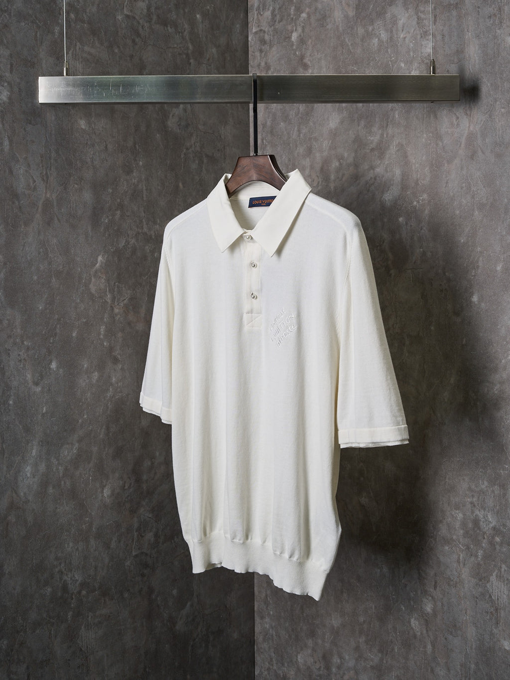 White polo shirt with spread collar and short sleeves