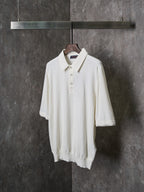 White short-sleeve polo shirt with collar and button-front placket