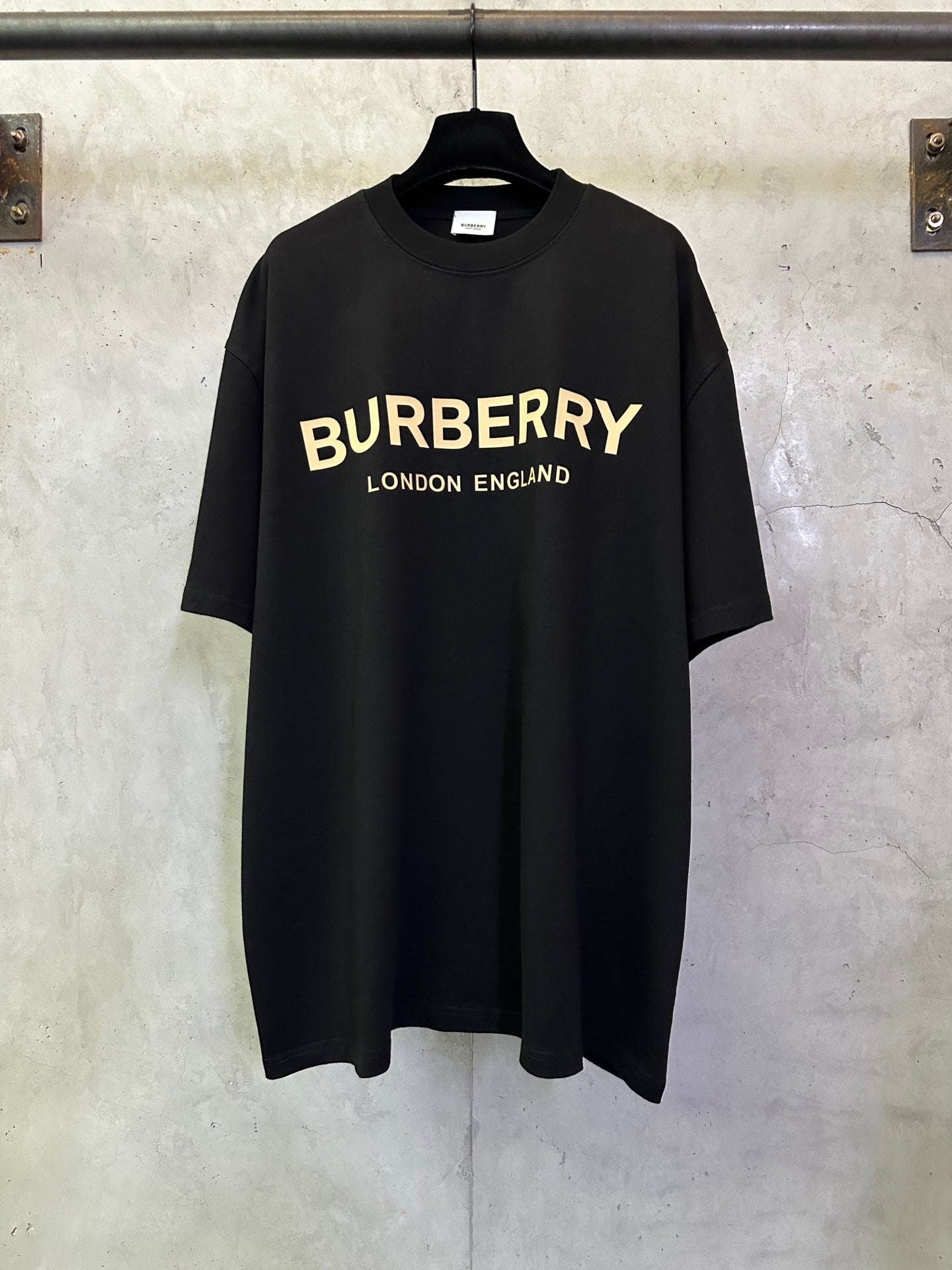 Black Burberry short-sleeve T-shirt with yellow 'BURBERRY' chest logo