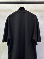 Black short-sleeve T-shirt, back view with draped sleeves