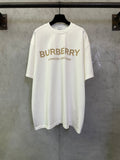 Off-white crewneck T-shirt with Burberry logo and “London England” text on the front