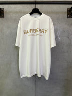 Off-white crewneck T-shirt with Burberry logo and “London England” text on the front