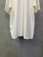 Off-white crewneck T-shirt back view with side sleeve openings and straight hem