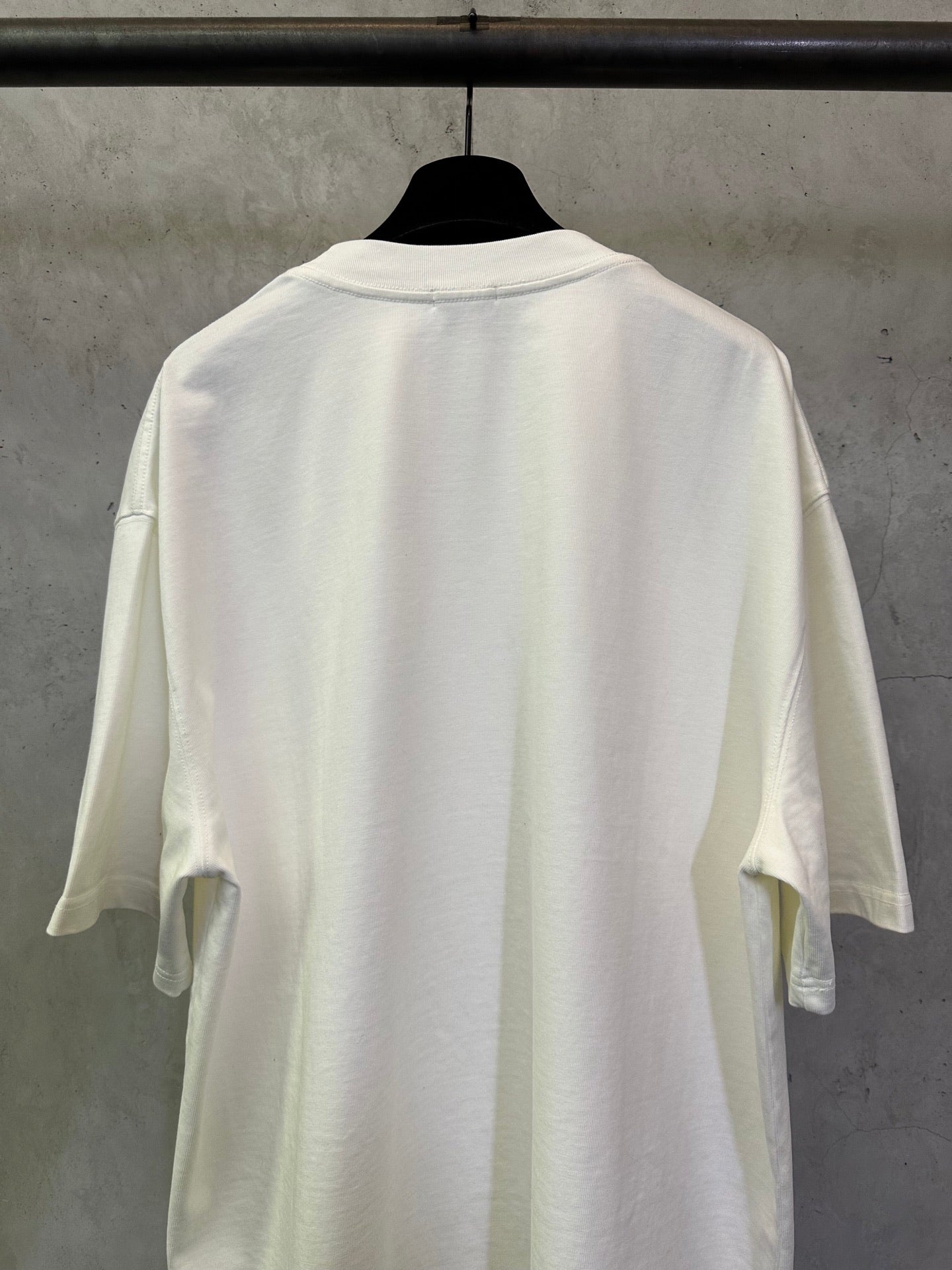 Off-white crewneck T-shirt, back view with wide short sleeves