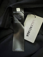 Balenciaga polo shirt neck label and size tag on black fabric