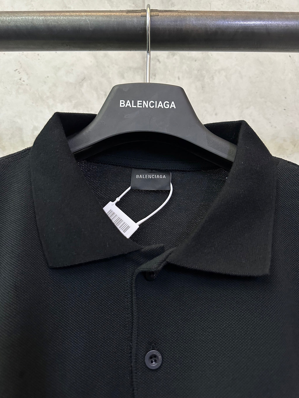 Balenciaga polo shirt close-up with pointed collar and button placket