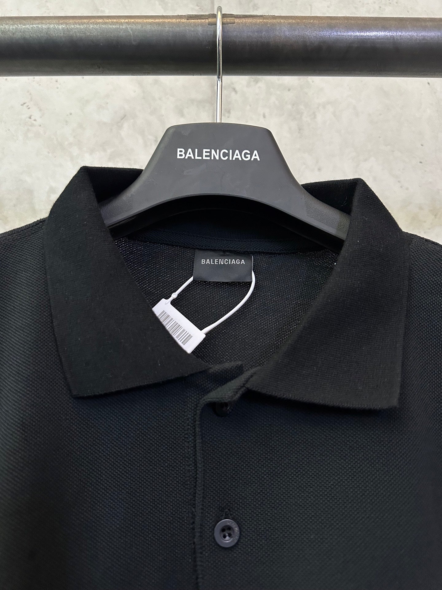 Balenciaga polo shirt close-up with pointed collar and button placket