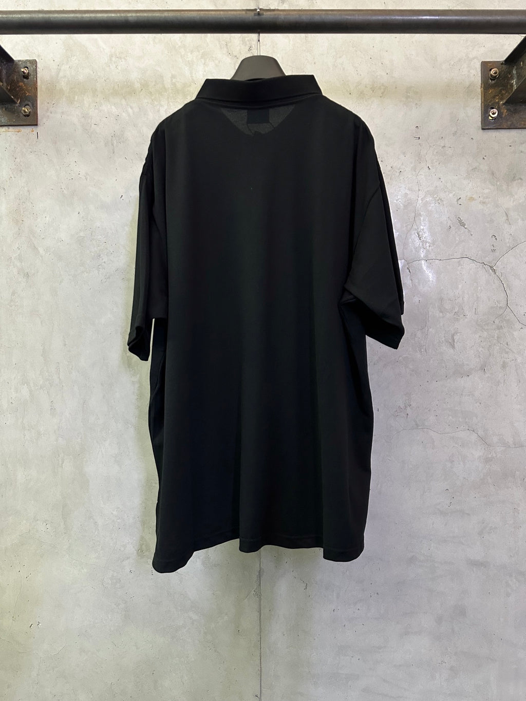 Balenciaga black polo shirt, back view, short sleeves and relaxed fit