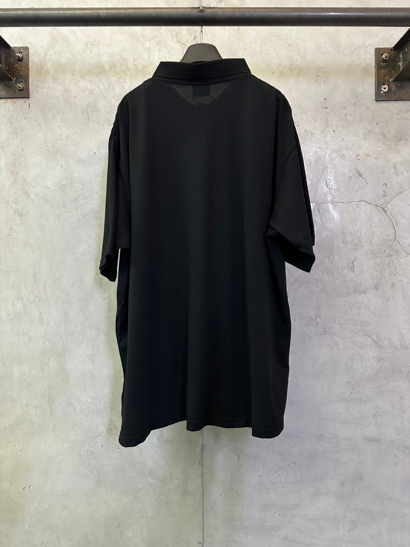 Balenciaga black polo shirt, back view, short sleeves and relaxed fit