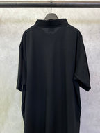 Balenciaga black polo shirt, back view with short sleeves and rounded collar