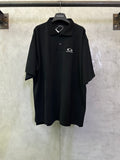 Balenciaga black polo shirt with short sleeves and chest logo patch