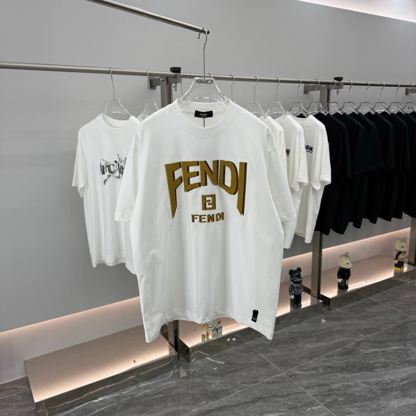 Fendi white short-sleeve T-shirt with gold FENDI logo on the front