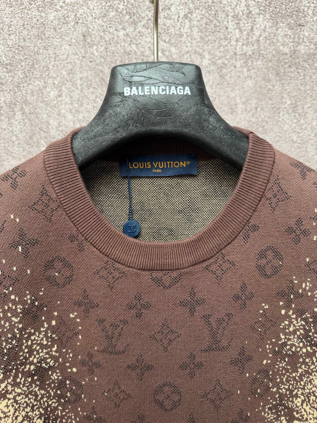 Short-sleeve T-shirt collar close-up with Balenciaga and Louis Vuitton hang tag