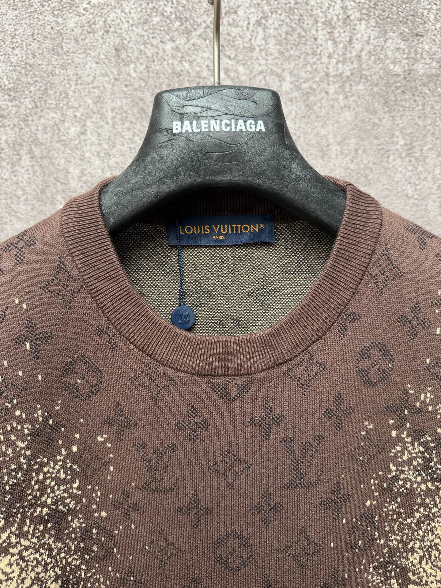 Short-sleeve T-shirt collar close-up with Balenciaga and Louis Vuitton hang tag