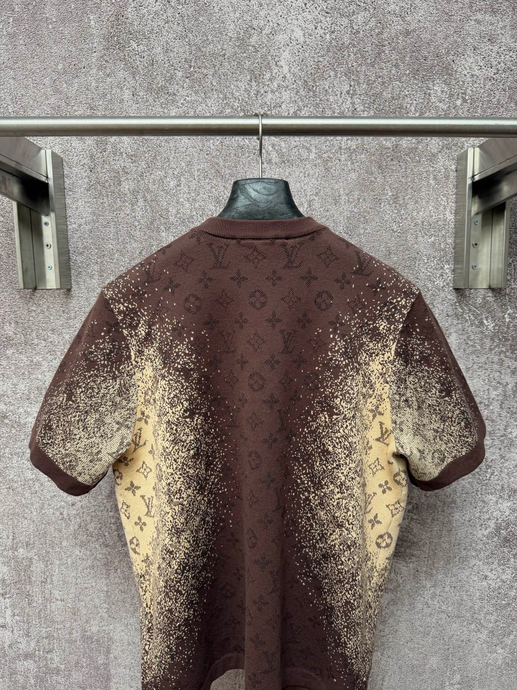 Short-sleeve T-shirt back view, dark brown with yellow monogram-style print