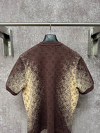 Short-sleeve T-shirt back view, dark brown with yellow monogram-style print