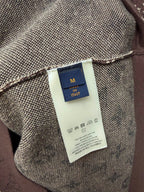 Clothing label close-up on short-sleeve T-shirt fabric, size tag and logo text