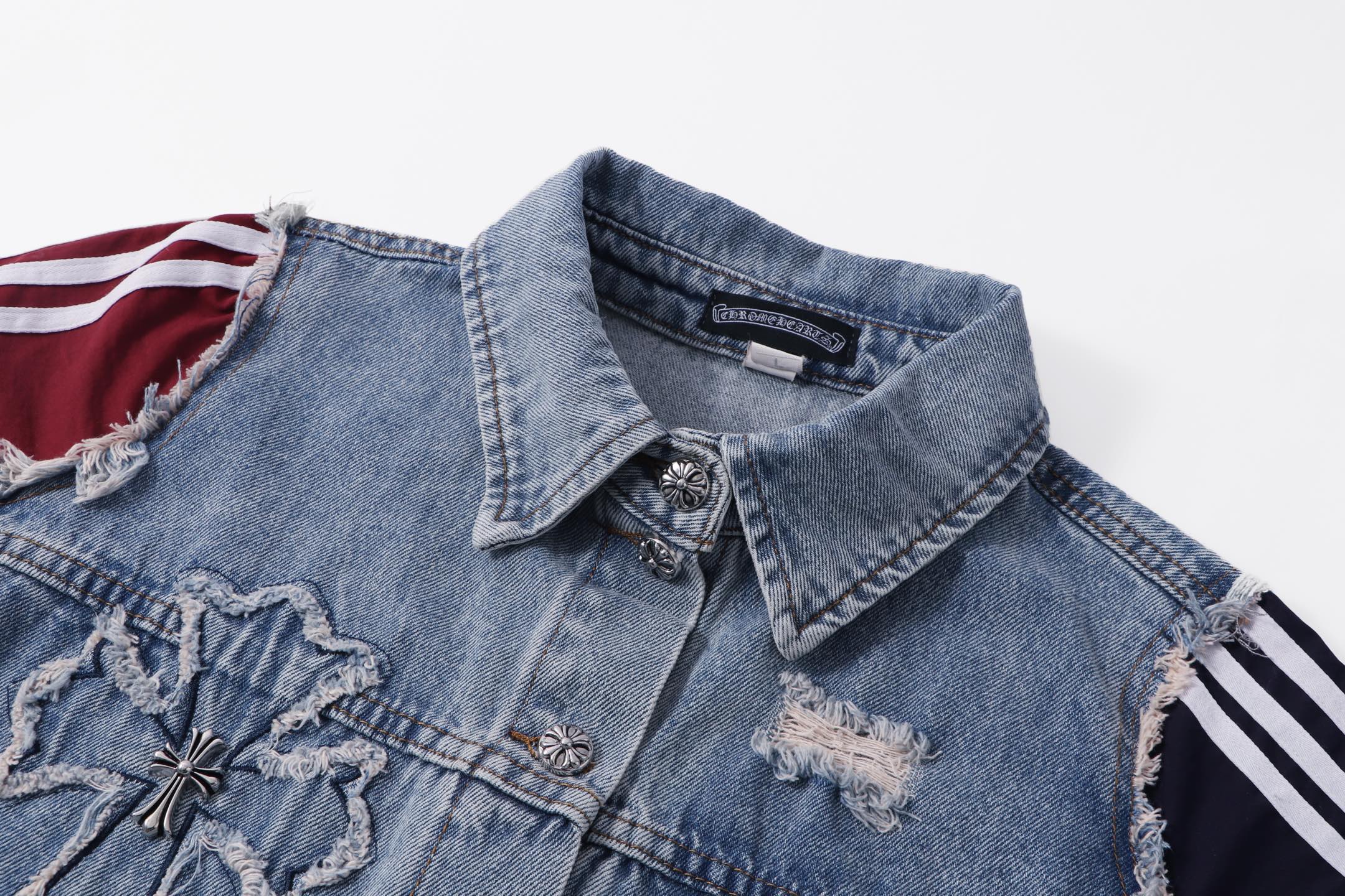 Light-wash denim jacket collar with applique patches and front button placket