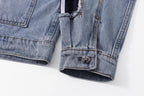 Denim jacket cuff and hem with buttoned pocket patch detail