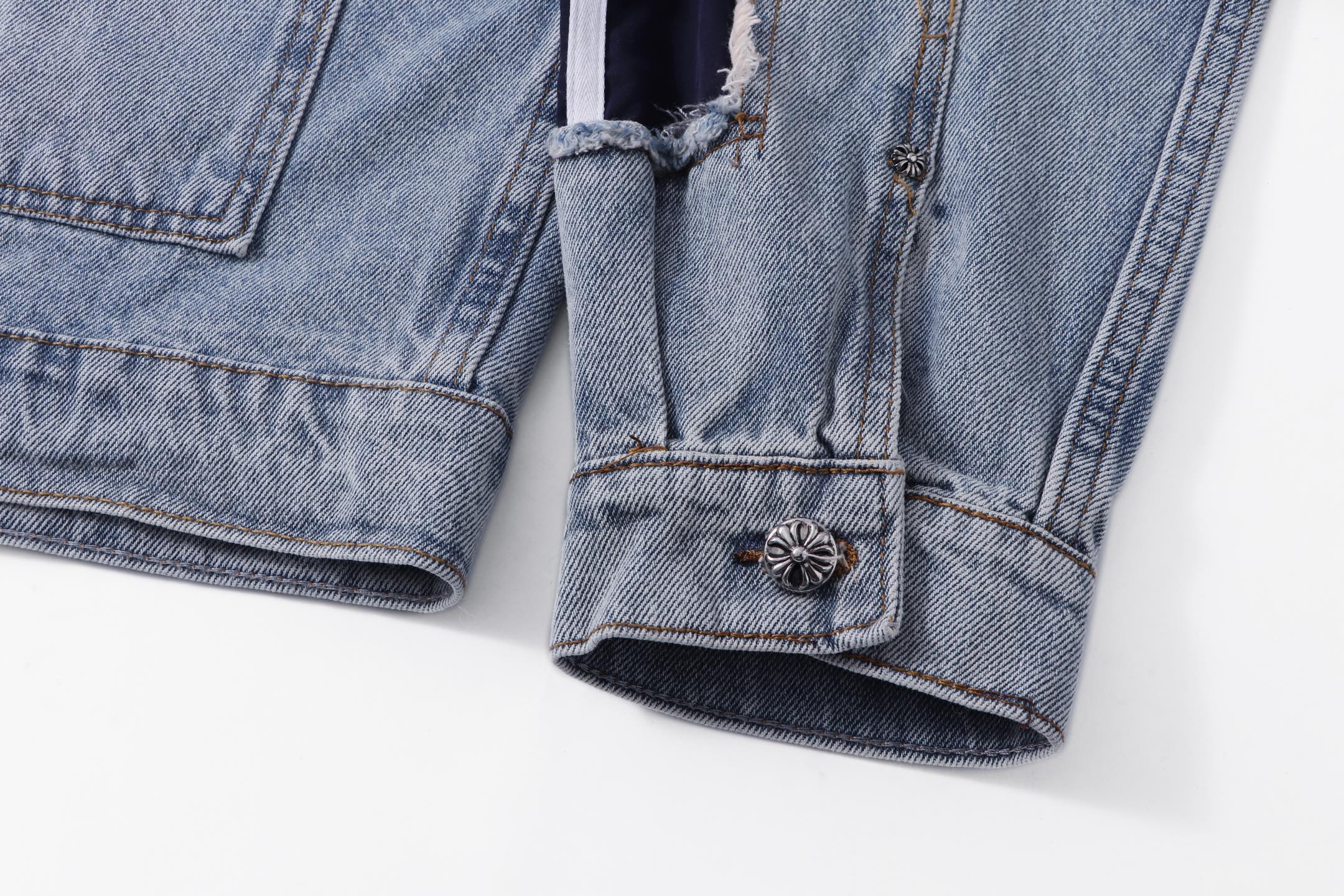 Denim jacket cuff and hem with buttoned pocket patch detail