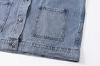 Denim jacket hem and pocket flap with decorative buttons