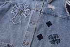 Denim jacket front detail with cross patch, black flower motifs, and buttons
