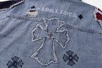 Denim jacket back detail with large cross applique and flower embroidery