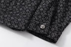 Dark patterned shirt cuff and decorative button detail