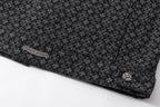 Dark patterned shirt hem with side label patch and silver-tone button